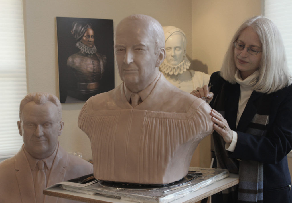 Paula Slater sculpting Portrait bust of Judge Leroy Contie