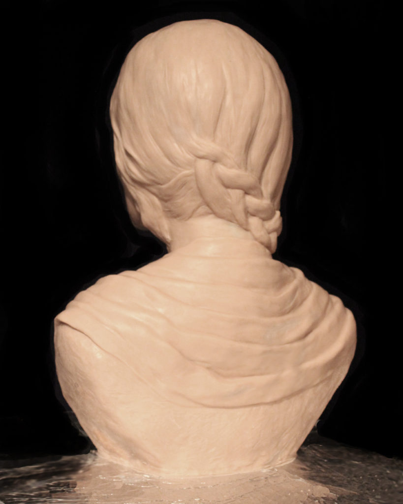 Beautifully detailed clay for bronze portrait of Mahsa Amin by Paula Slater Sculpture